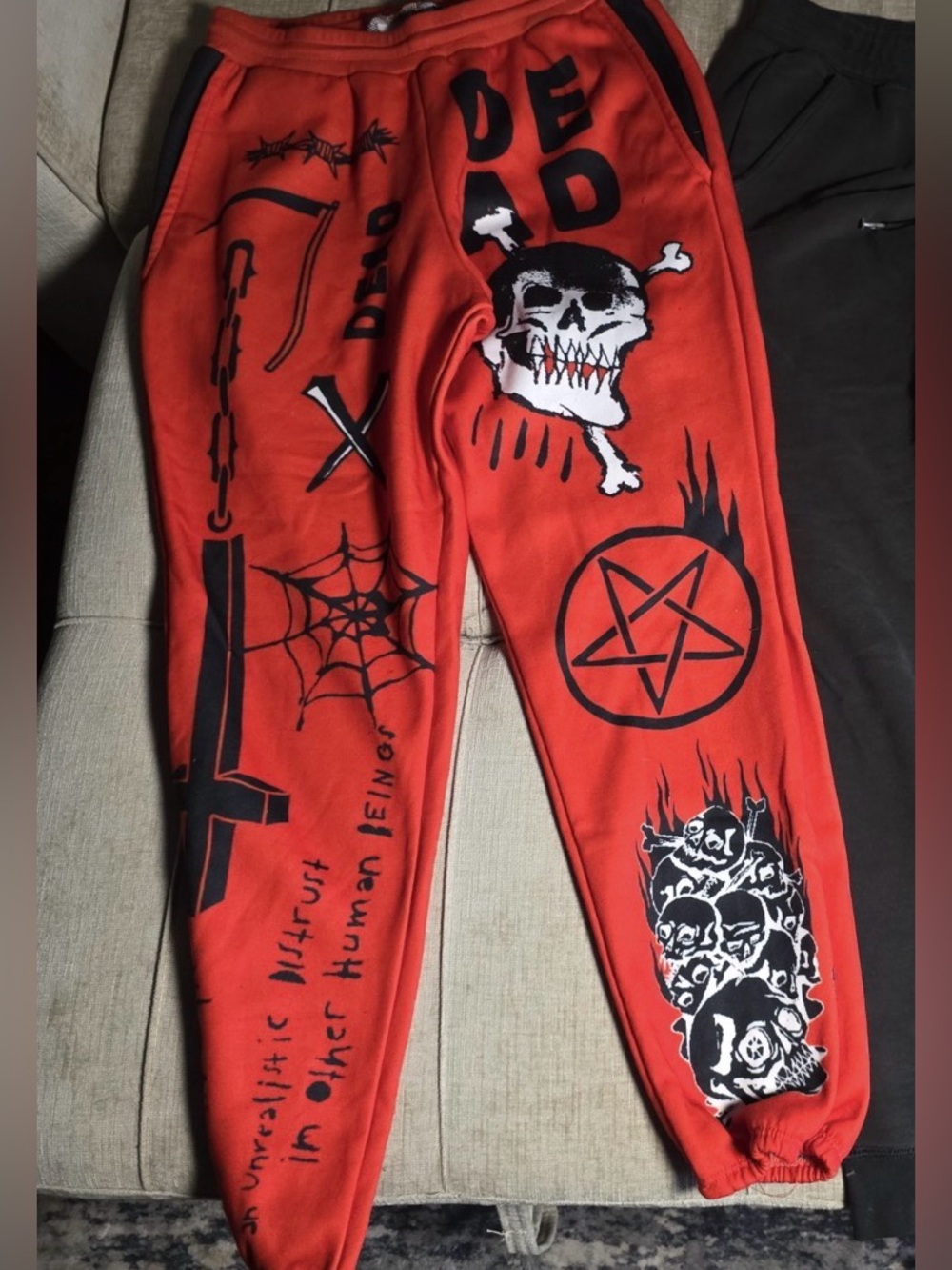 Teen Hearts orange joggers with skulls and pentagrams